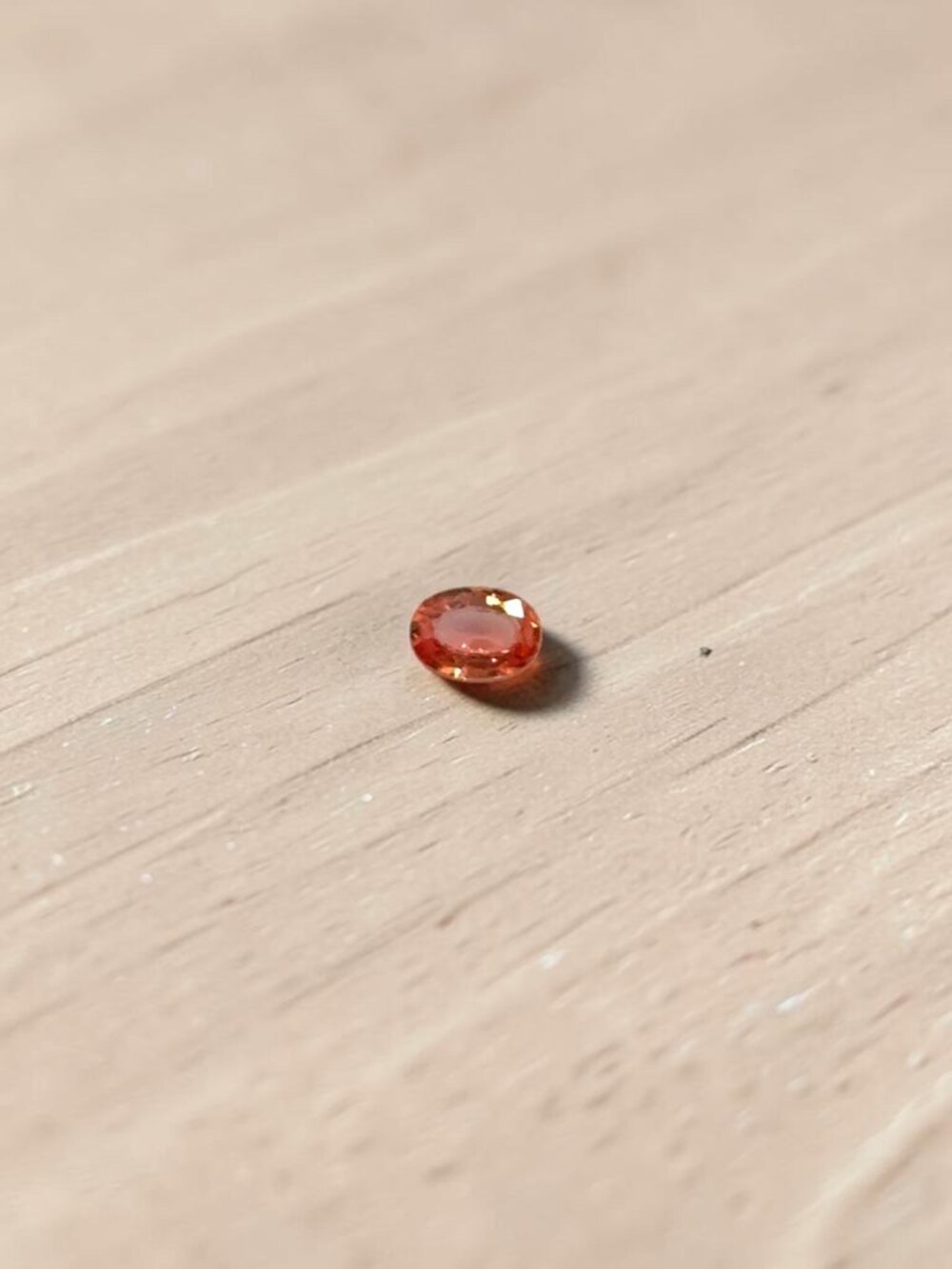 0.53 Carat Oval Orange Sapphire Gemstone
